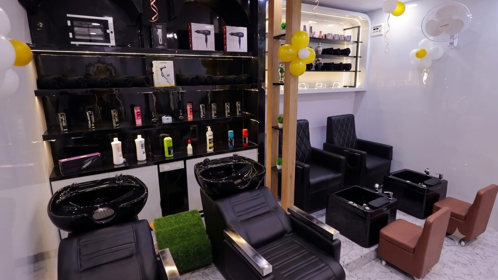 Wash basins and the professional retail shelf at Hairways Salon