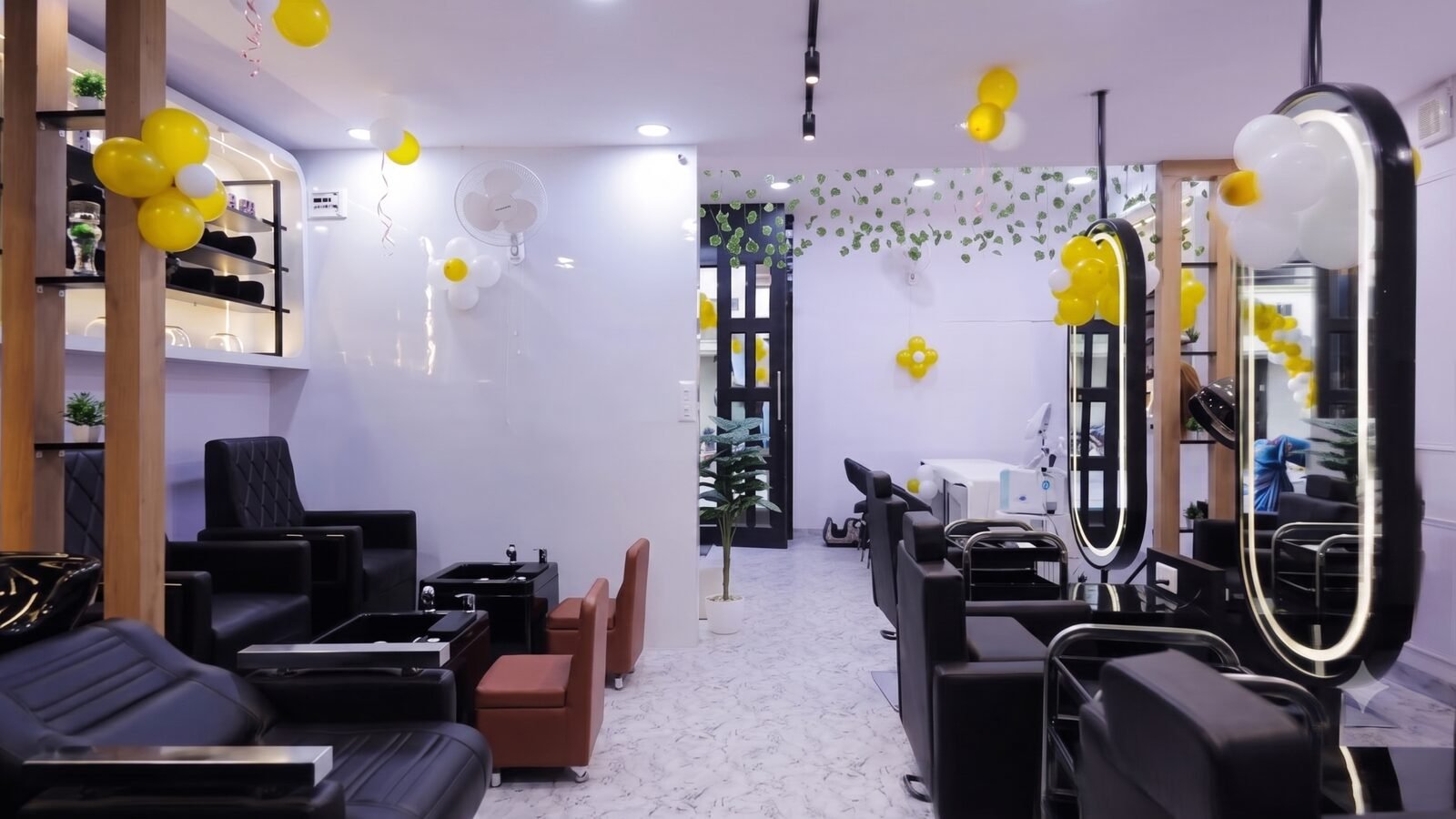 Styling stations and lit mirrors on the floor at Hairways Salon